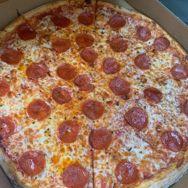 A large, freshly baked pepperoni pizza from Mama Mia's, with melted cheese and a golden crust.